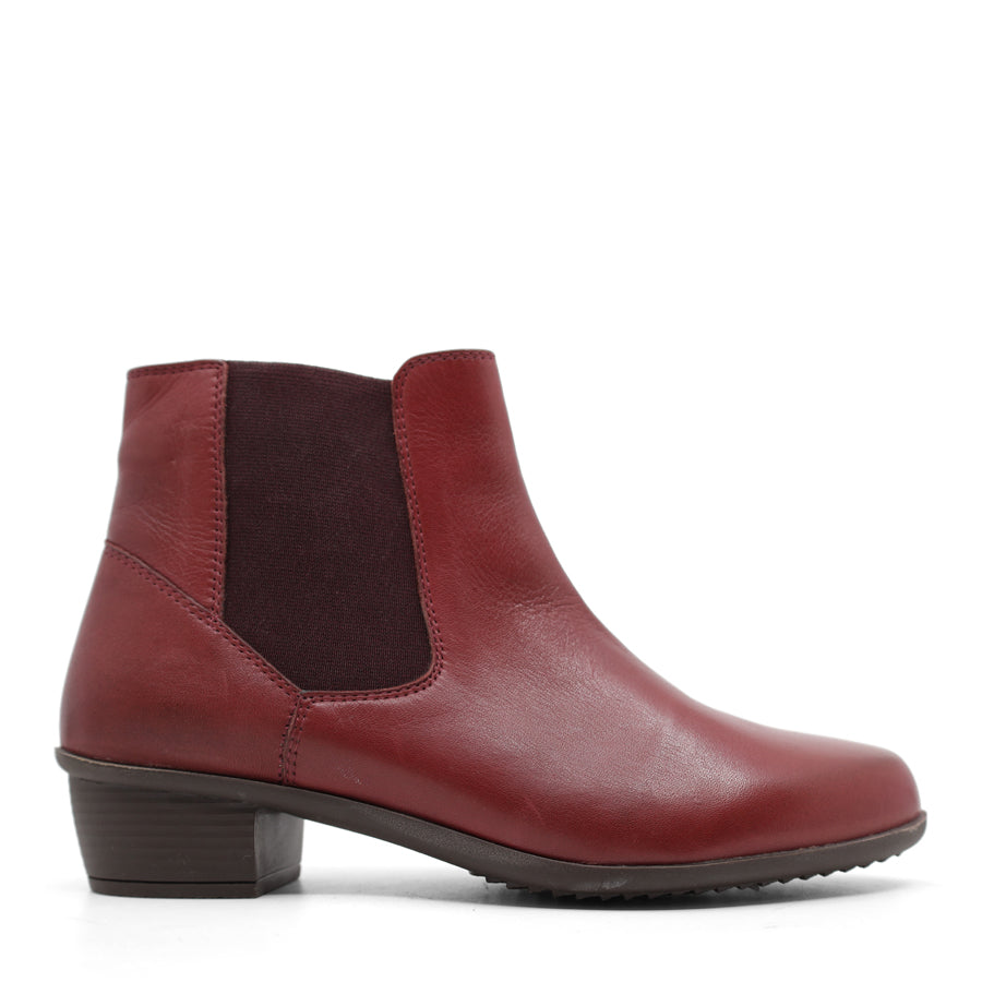 SIDE VIEW OF BLACK ANKLE BOOT WITH SMALL HEEL