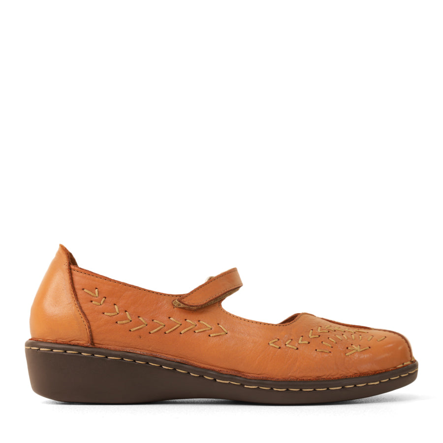 SIDE VIEW OF TAN LEATHER CASUAL SHOE WITH VELCRO STRAP AND WHITE STITCHING DETAIL