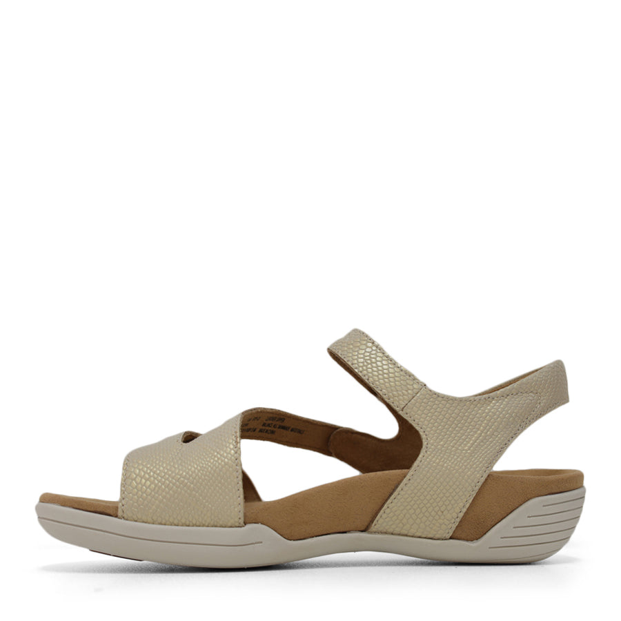 SIDE VIEW OF GOLD FLAT SANDAL WITH OPEN TOE, OPEN BACK, WHITE SOLE AND THREE STRAPS ACROSS THE FRONT 