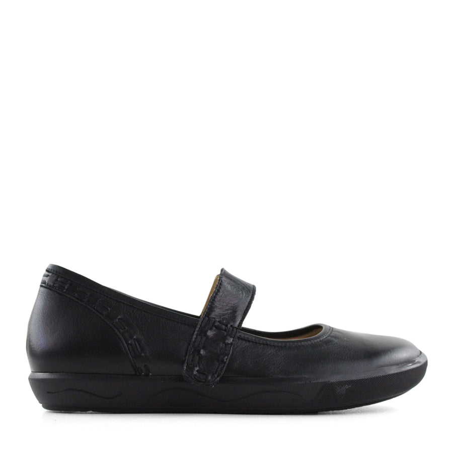SIDE VIEW OF BLACK CASUAL SHOE WITH MARY JANE STYLE STRAP ACROSS THE TOP