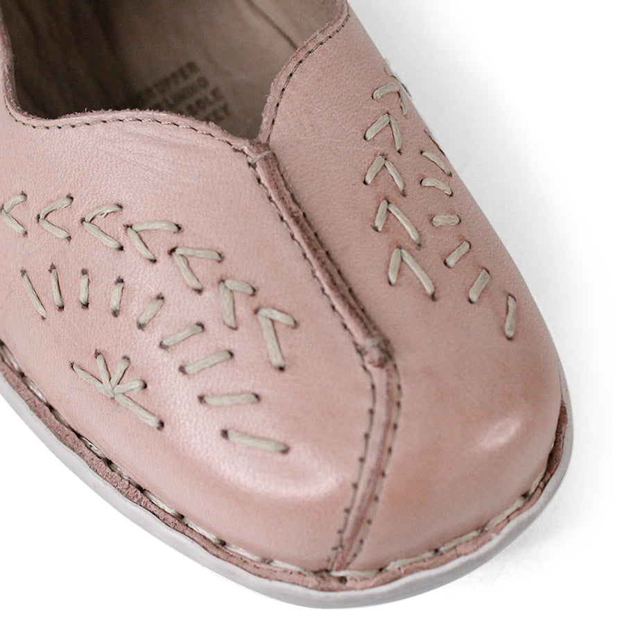 FRONT VIEW OF PINK LEATHER CASUAL SHOE WITH VELCRO STRAP AND WHITE STITCHING DETAIL