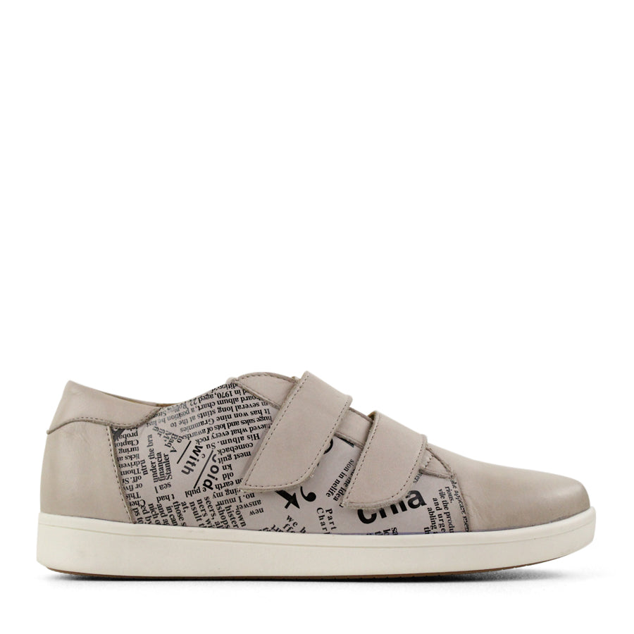 SIDE VIEW OF BEIGE NEWSPAPER PRINT SNEAKER WITH TWO VELCRO STRAPS AND WHITE SOLE  
