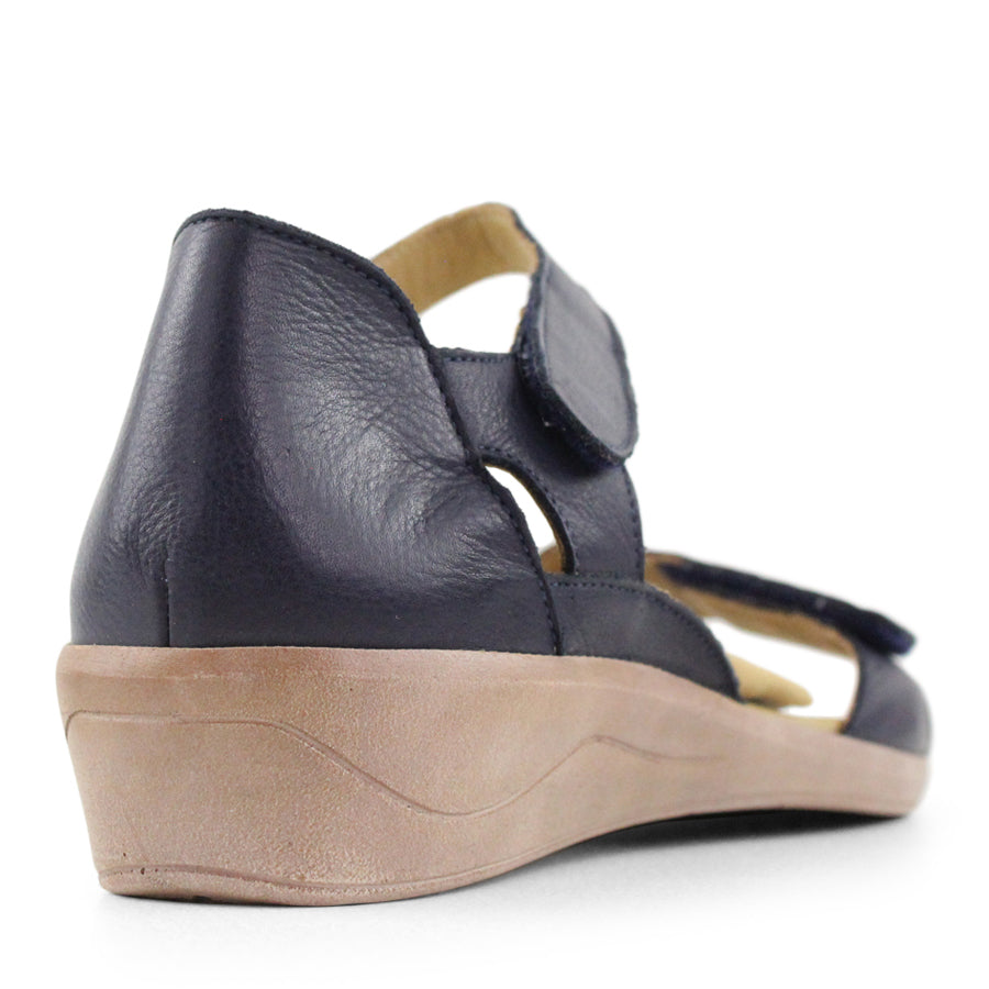 BACK VIEW OF NAVY SANDAL WITH VELCRO STRAP AND SMALL HEEL 