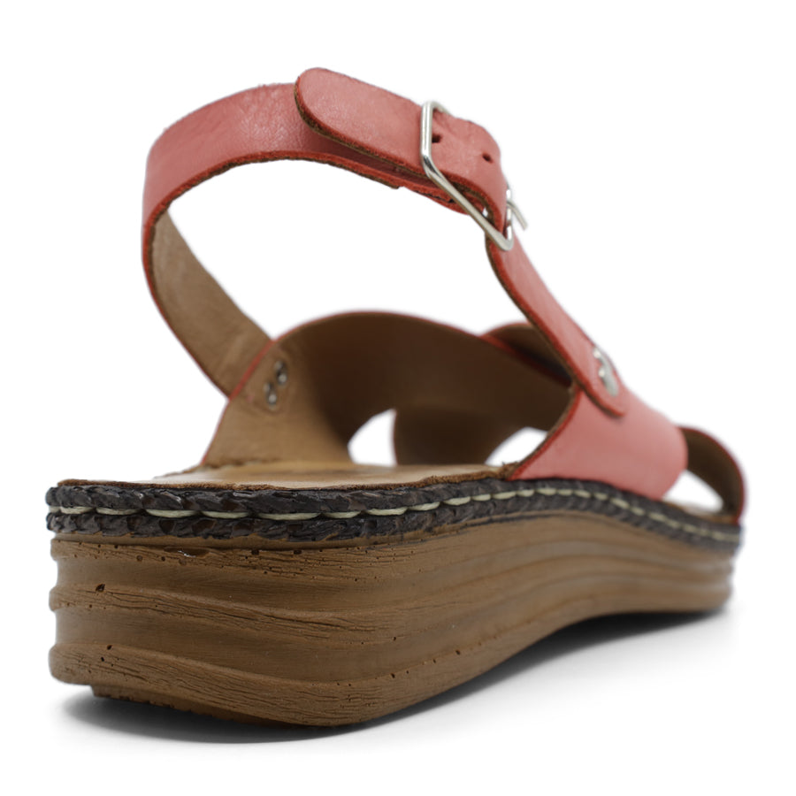 BACK VIEW OF PINK LEATHER CRISS CROSS FRONT SANDAL WITH ADJUSTABLE BUCKLE AND CUSHIONED SOLE