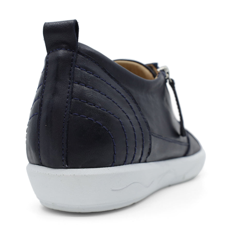 BACK VIEW OF NAVY LACE UP SNEAKER WITH SIDE ZIP AND WHITE SOLE 
