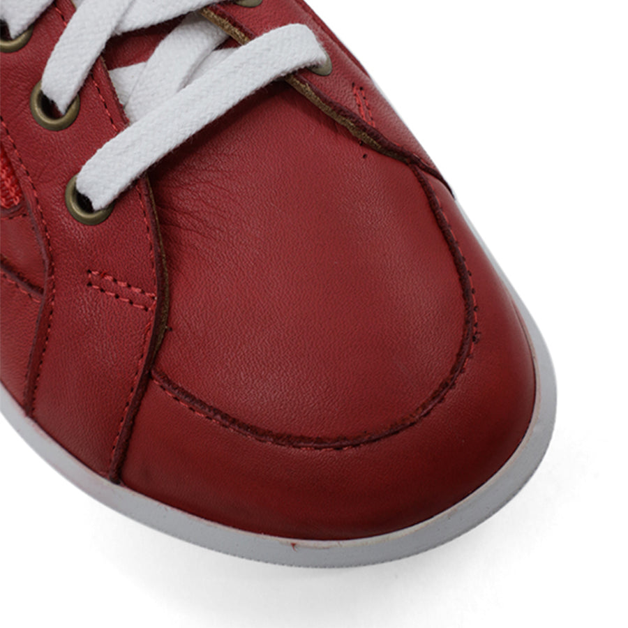 FRONT VIEW OF RED LACE UP SNEAKER WITH SIDE ZIP AND WHITE SOLE 