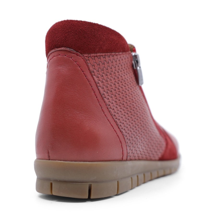 BACK VIEW OF RED ANKLE BOOT WITH SUEDE ATCHWORK DETAIL AND RUBBER SOLE 