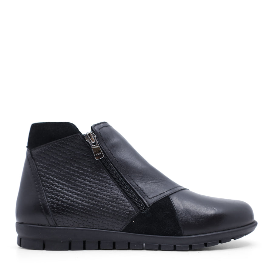 SIDE VIEW OF BLACK ANKLE BOOT WITH SUEDE ATCHWORK DETAIL AND RUBBER SOLE 