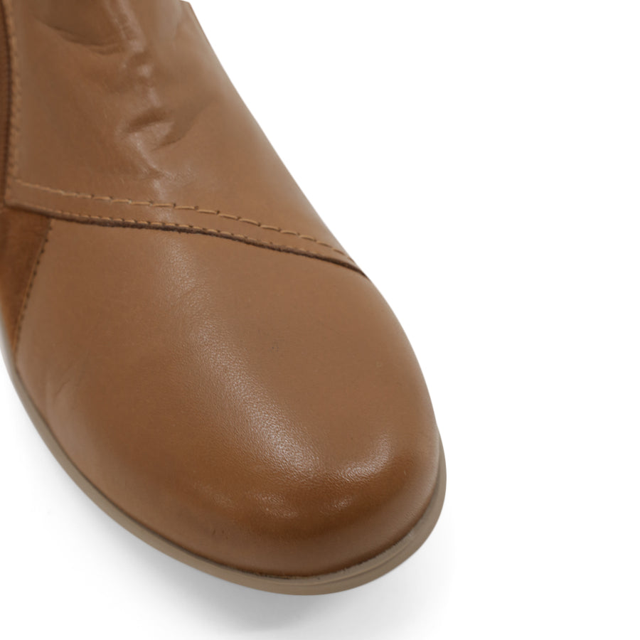 FRONT VIEW OF TAN ANKLE BOOT WITH SUEDE ATCHWORK DETAIL AND RUBBER SOLE 
