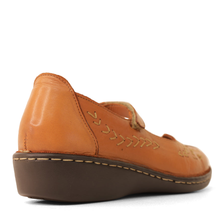 BACK VIEW OF TAN LEATHER CASUAL SHOE WITH VELCRO STRAP AND WHITE STITCHING DETAIL