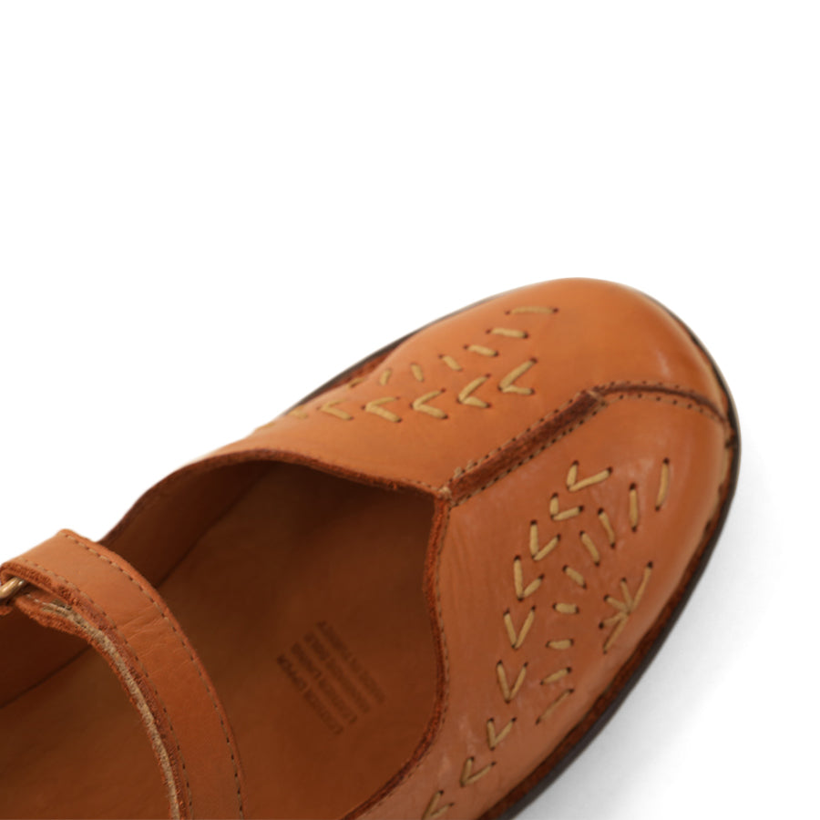 FRONT VIEW OF TAN LEATHER CASUAL SHOE WITH VELCRO STRAP AND WHITE STITCHING DETAIL