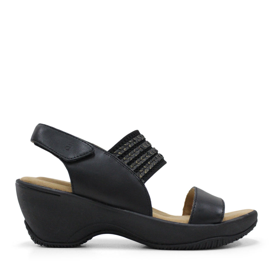 SIDE VIEW OF GREEN MID HEEL WITH Y BACK STRAP AND VELCRO ADJUSTABLE STRAP. WHITE SOLE 