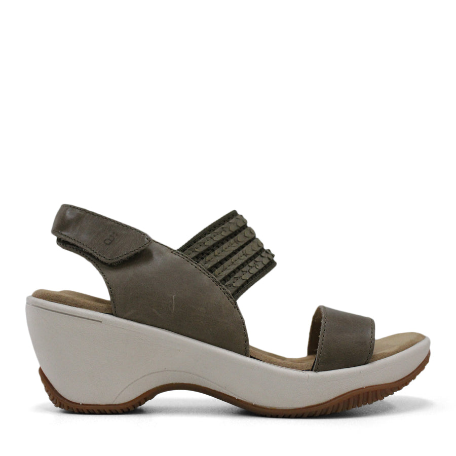 SIDE VIEW OF GREEN MID HEEL WITH Y BACK STRAP AND VELCRO ADJUSTABLE STRAP. WHITE SOLE 