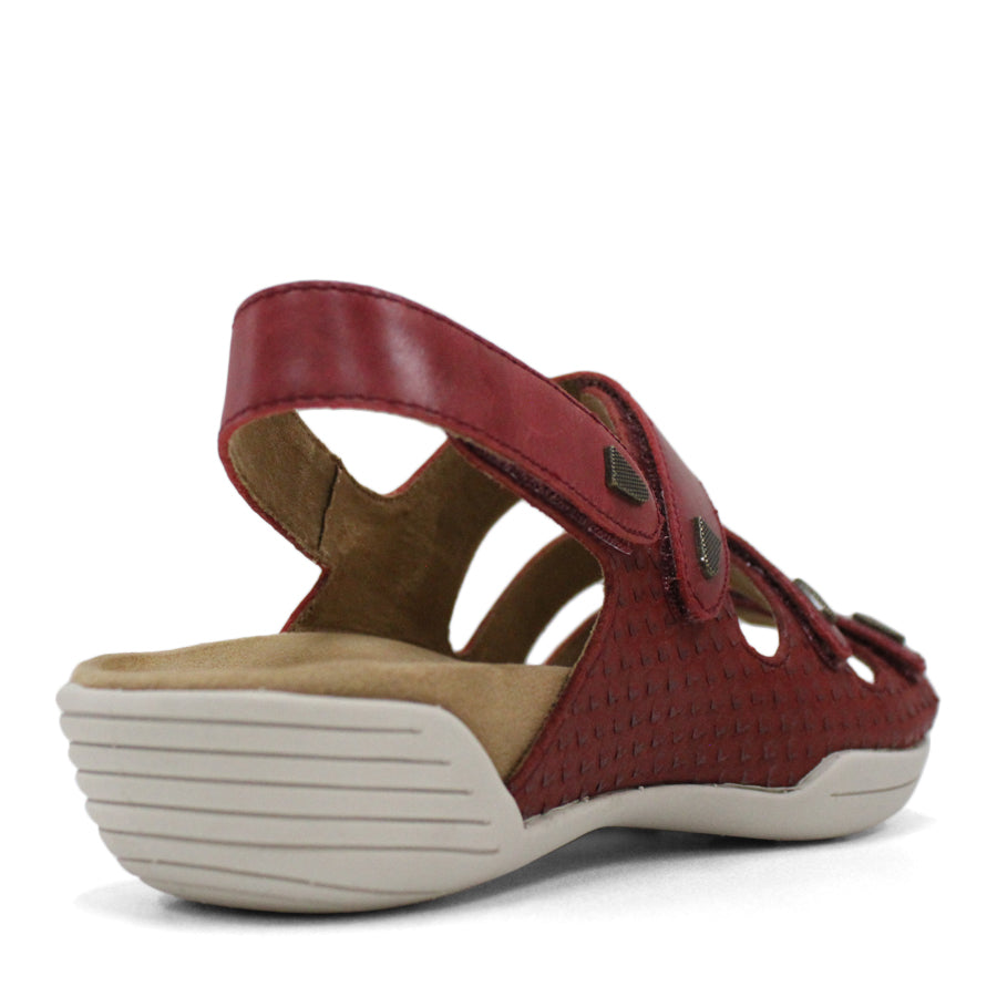 BACK VIEW OF RED FLAT SANDAL WITH 3 STRAPS OVER THE FOOT AND ONE AROUND THE HEEL. TRIANGLE PATTERN DETAIL. 