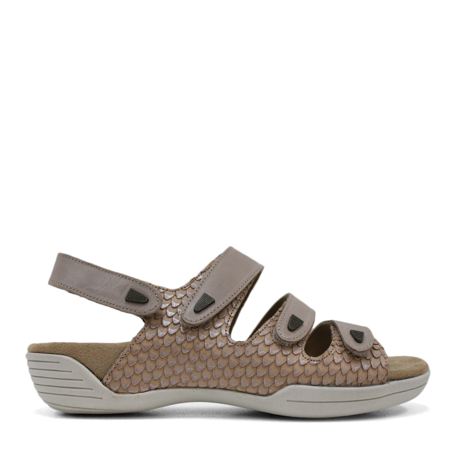 SIDE VIEW OF TAUPE FLAT SANDAL WITH 3 STRAPS OVER THE FOOT AND ONE AROUND THE HEEL. TRIANGLE PATTERN DETAIL. 