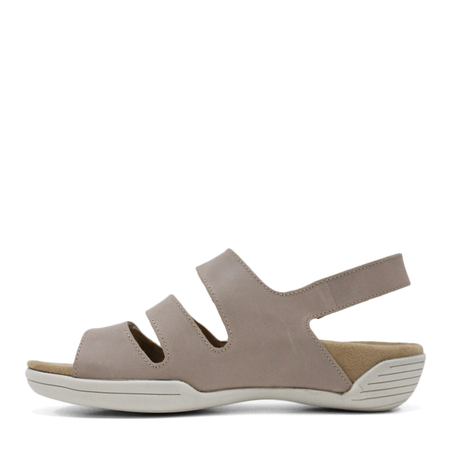 SIDE VIEW OF TAUPE FLAT SANDAL WITH 3 STRAPS OVER THE FOOT AND ONE AROUND THE HEEL. TRIANGLE PATTERN DETAIL. 