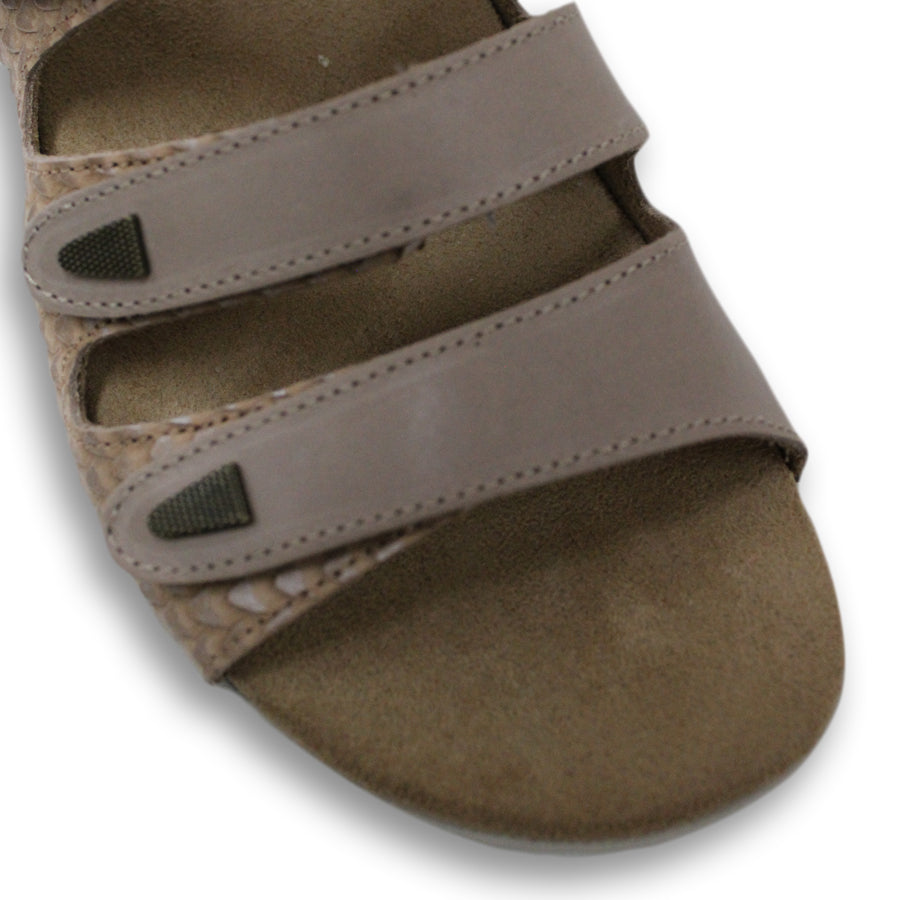 FRONT VIEW OF TAUPE FLAT SANDAL WITH 3 STRAPS OVER THE FOOT AND ONE AROUND THE HEEL. TRIANGLE PATTERN DETAIL. 