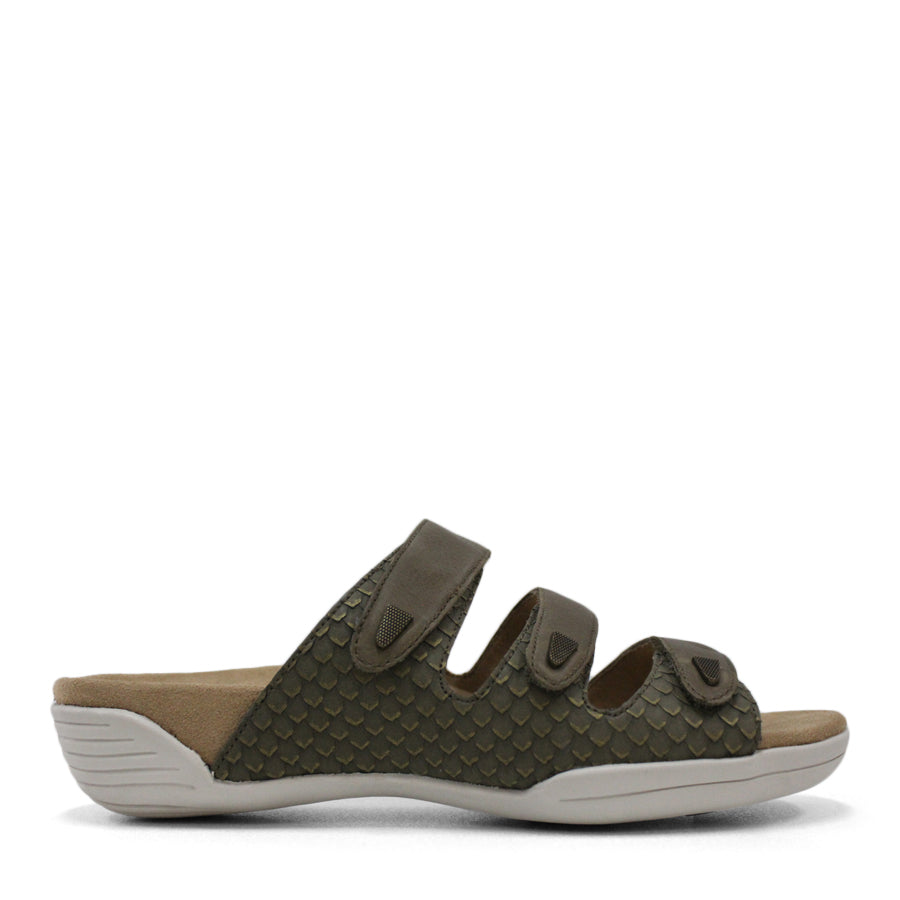 SIDE VIEW OF RED FLAT SANDAL WITH TRANGLE TEXTURED SIDE PANELS, OPEN TOE, OPEN BACK, WHITE SOLE AND THREE STRAPS ACROSS THE FRONT 