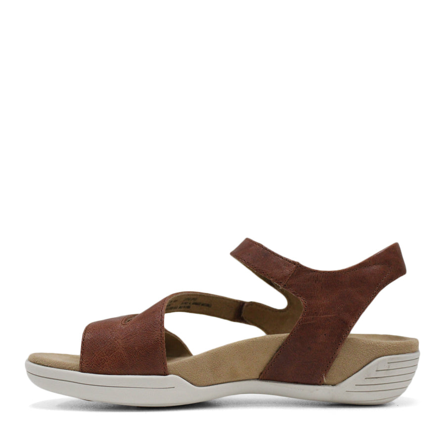 SIDE VIEW OF BROWN FLAT SANDAL WITH OPEN TOE, OPEN BACK, WHITE SOLE AND THREE STRAPS ACROSS THE FRONT 