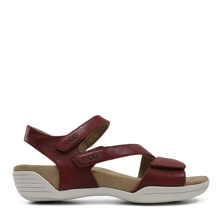 SIDE VIEW OF RED FLAT SANDAL WITH OPEN TOE, OPEN BACK, WHITE SOLE AND THREE STRAPS ACROSS THE FRONT 