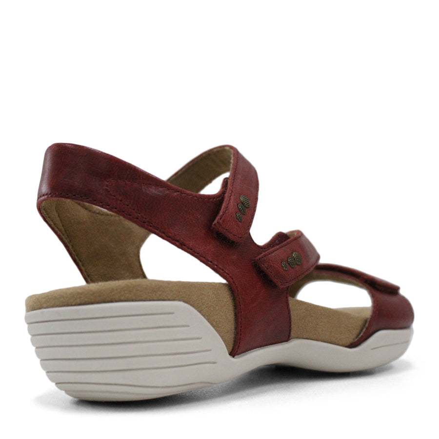 BACK VIEW OF RED FLAT SANDAL WITH OPEN TOE, OPEN BACK, WHITE SOLE AND THREE STRAPS ACROSS THE FRONT 