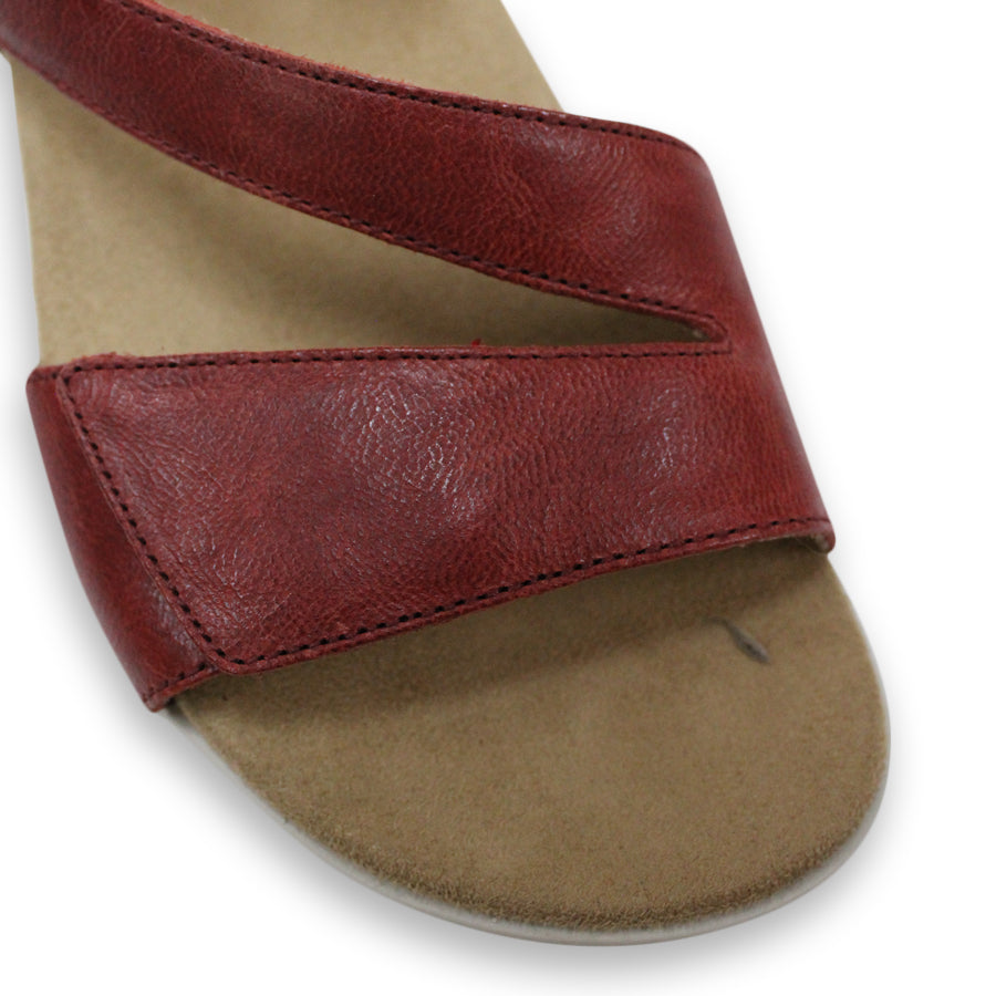 FRONT VIEW OF RED FLAT SANDAL WITH OPEN TOE, OPEN BACK, WHITE SOLE AND THREE STRAPS ACROSS THE FRONT 