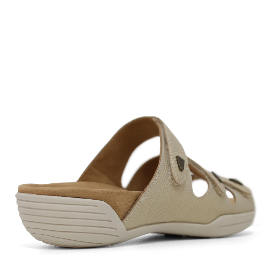 BACK VIEW OF GOLD FLAT SANDAL WITH TRANGLE TEXTURED SIDE PANELS, OPEN TOE, OPEN BACK, WHITE SOLE AND THREE STRAPS ACROSS THE FRONT 