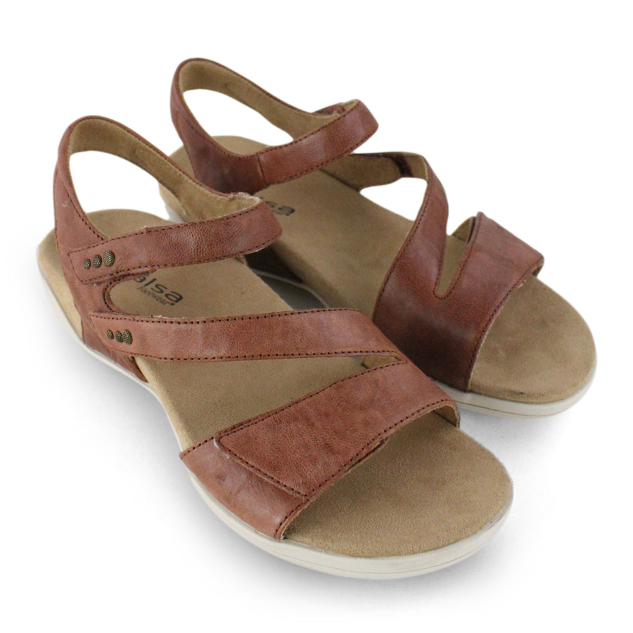 FRONT VIEW OF COGNAC FLAT SANDALS WITH OPEN TOE, OPEN BACK, WHITE SOLE AND THREE STRAPS ACROSS THE FRONT 