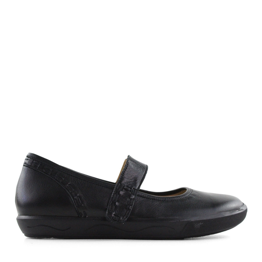 SIDE VIEW OF BLACK CASUAL SHOE WITH MARY JANE STYLE STRAP ACROSS THE TOP  AND WHITE STITCH DETAIL   