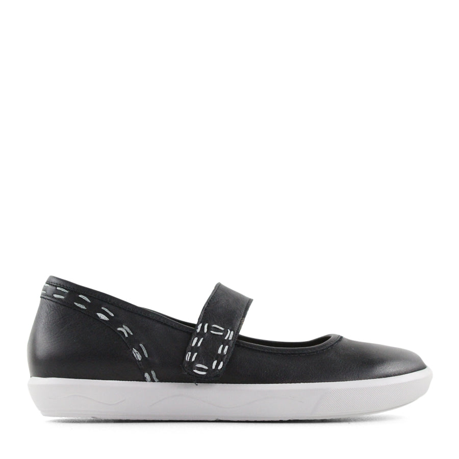 SIDE VIEW OF BLACK CASUAL SHOE WITH MARY JANE STYLE STRAP ACROSS THE TOP  AND WHITE STITCH DETAIL   
