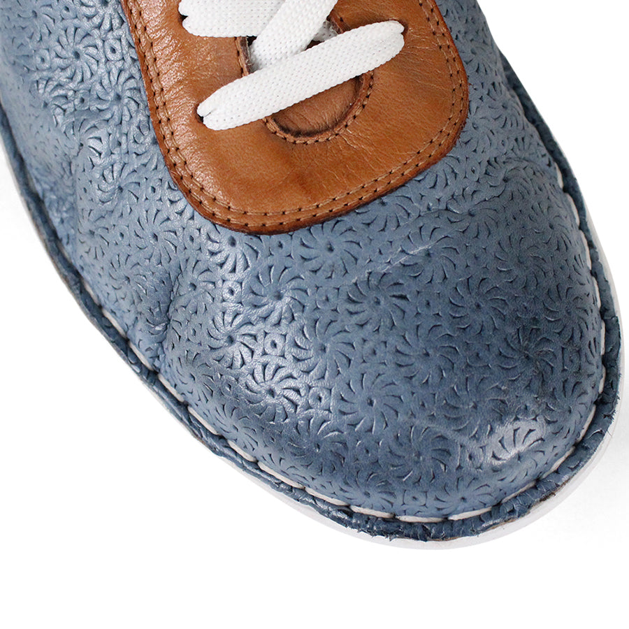 FRONT VIEW OF PATTERNED BLUE LEATHER LACE UP SNEAKER WITH TAN PANELS AND WHITE SOLE 