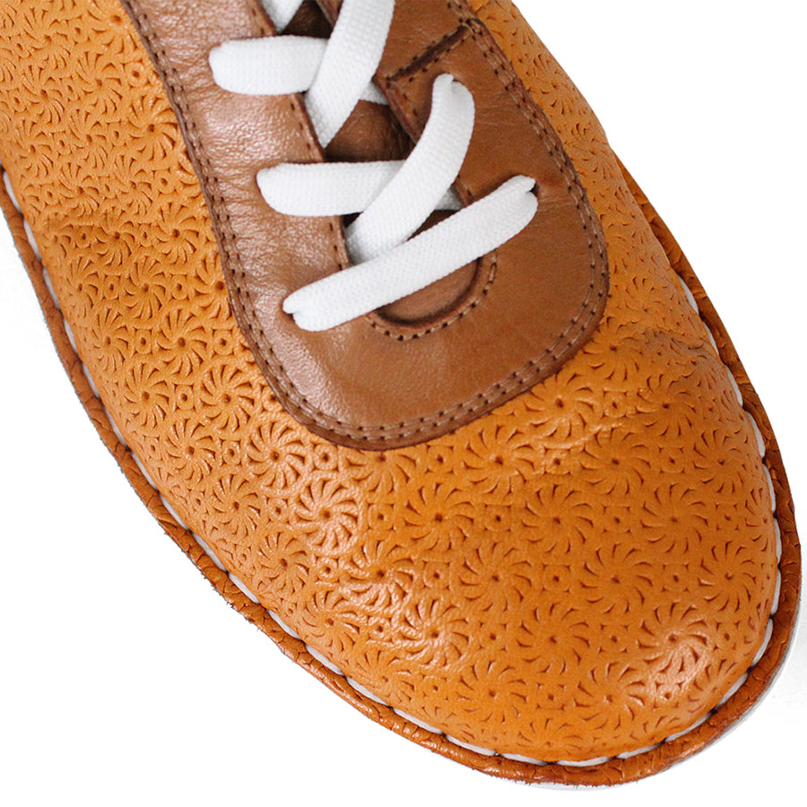 FRONT VIEW OF PATTERNED YELLOW LEATHER LACE UP SNEAKER WITH TAN PANELS AND WHITE SOLE 
