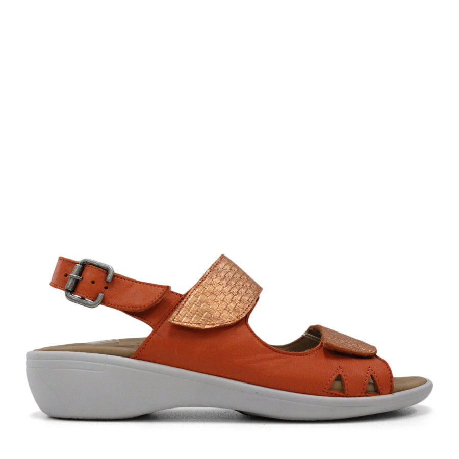 SIDE VIEW OF ORANGE Y BACK SANDAL WITH BUCKLE AND CUT OUT DETAILLING NEAR TOES 