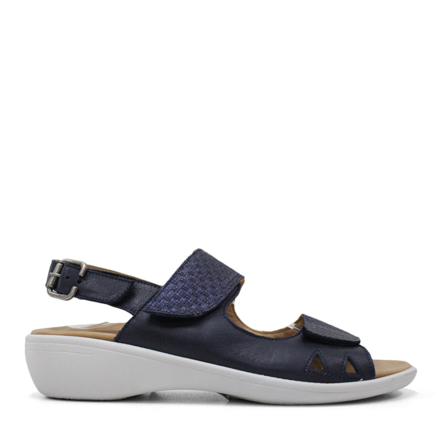 SIDE VIEW OF NAVY Y BACK SANDAL WITH BUCKLE AND CUT OUT DETAILLING NEAR TOES