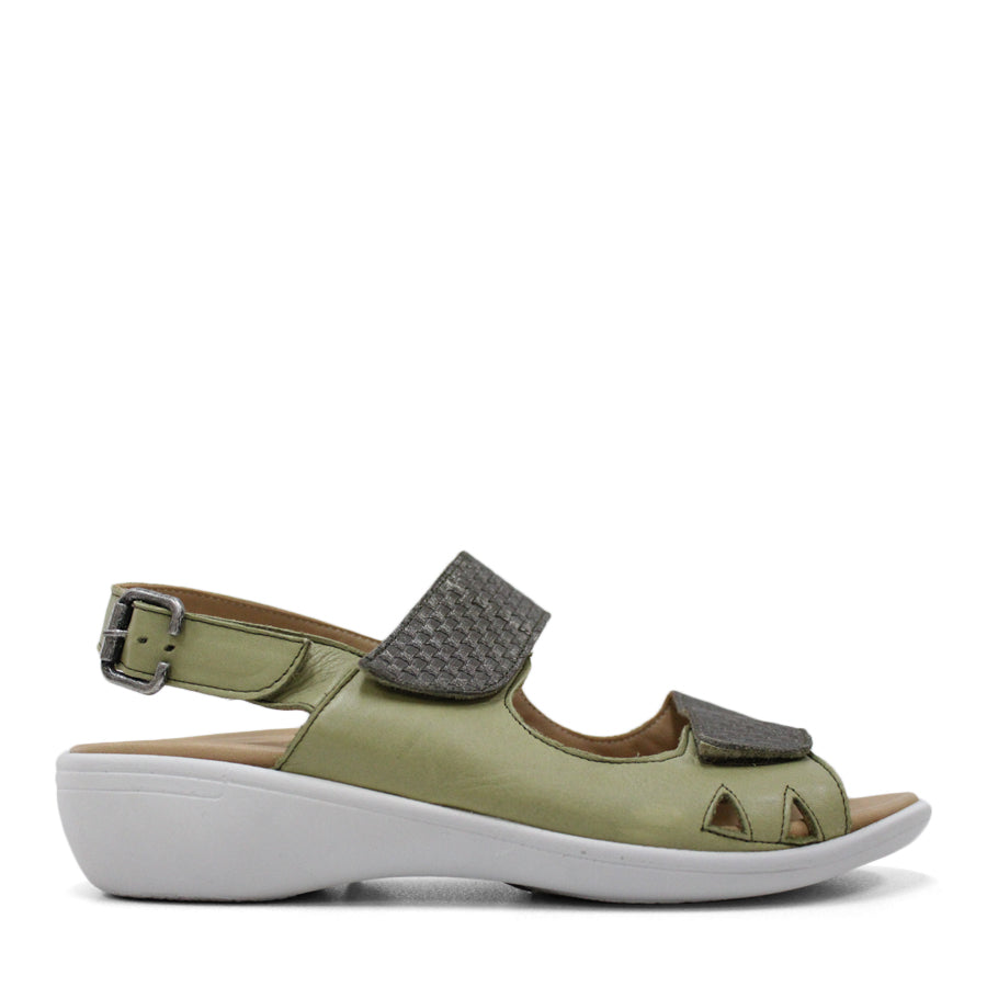 SIDE VIEW OF GREEN Y BACK SANDAL WITH BUCKLE AND CUT OUT DETAILLING NEAR TOES