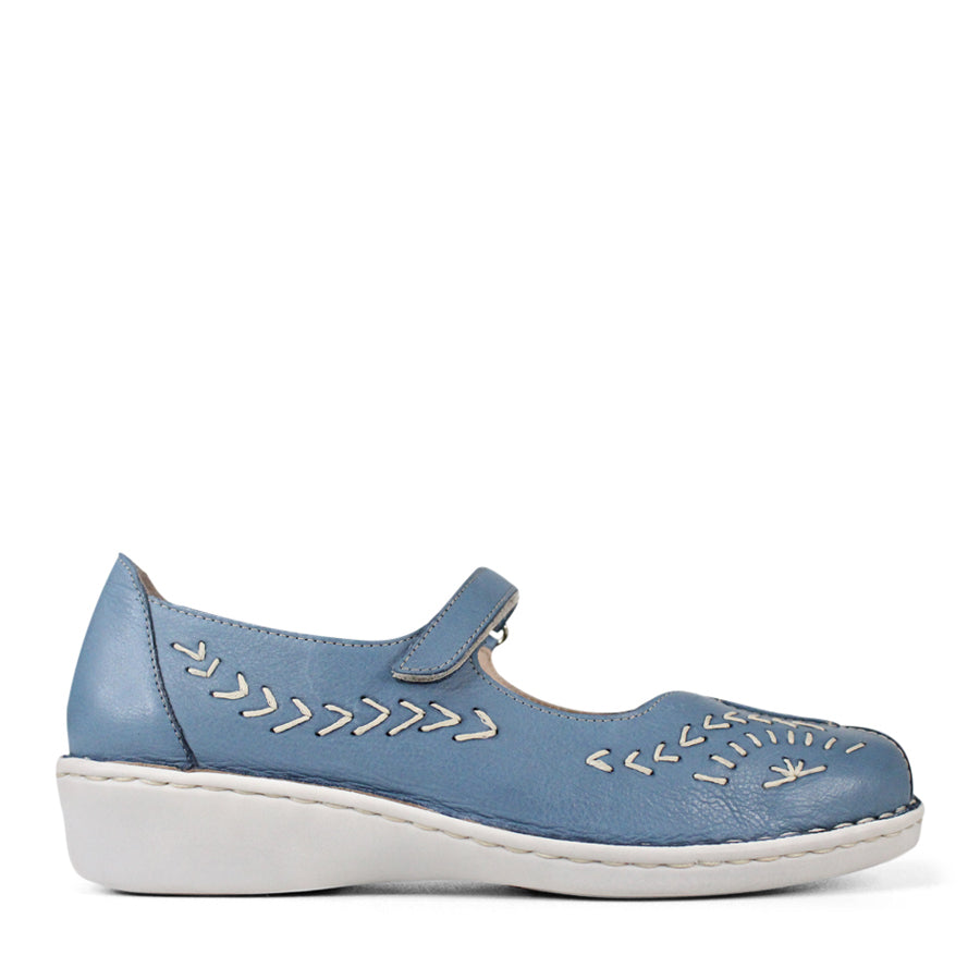 SIDE VIEW OF BLUE LEATHER CASUAL SHOE WITH VELCRO STRAP AND WHITE STITCHING DETAIL