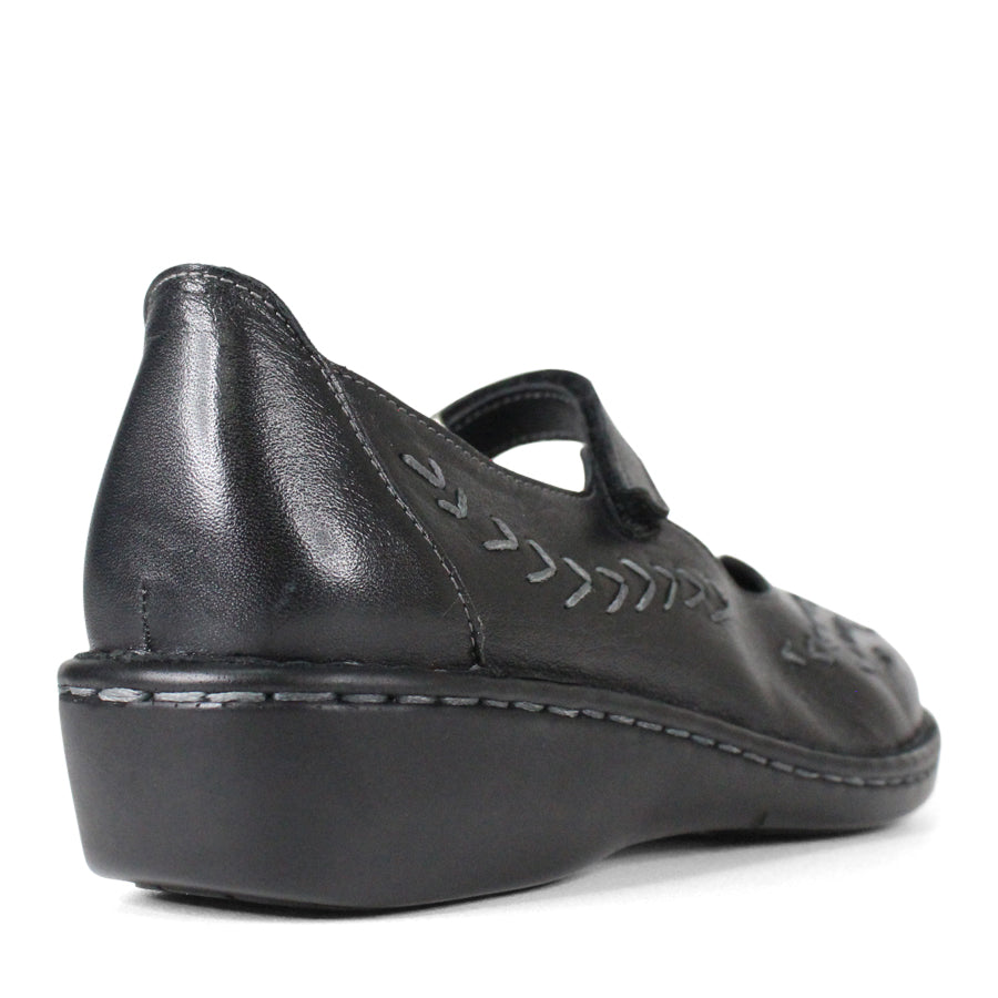 BACK VIEW OF BLACK LEATHER CASUAL SHOE WITH VELCRO STRAP AND WHITE STITCHING DETAIL