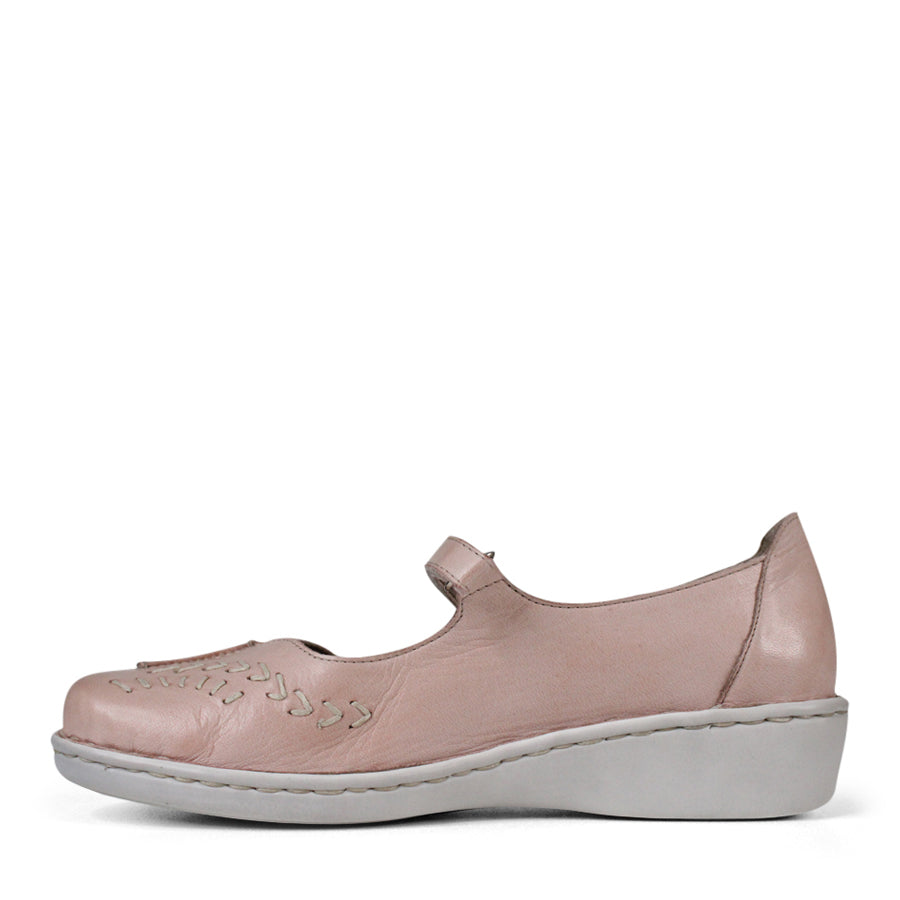 SIDE VIEW OF PINK LEATHER CASUAL SHOE WITH VELCRO STRAP AND WHITE STITCHING DETAIL