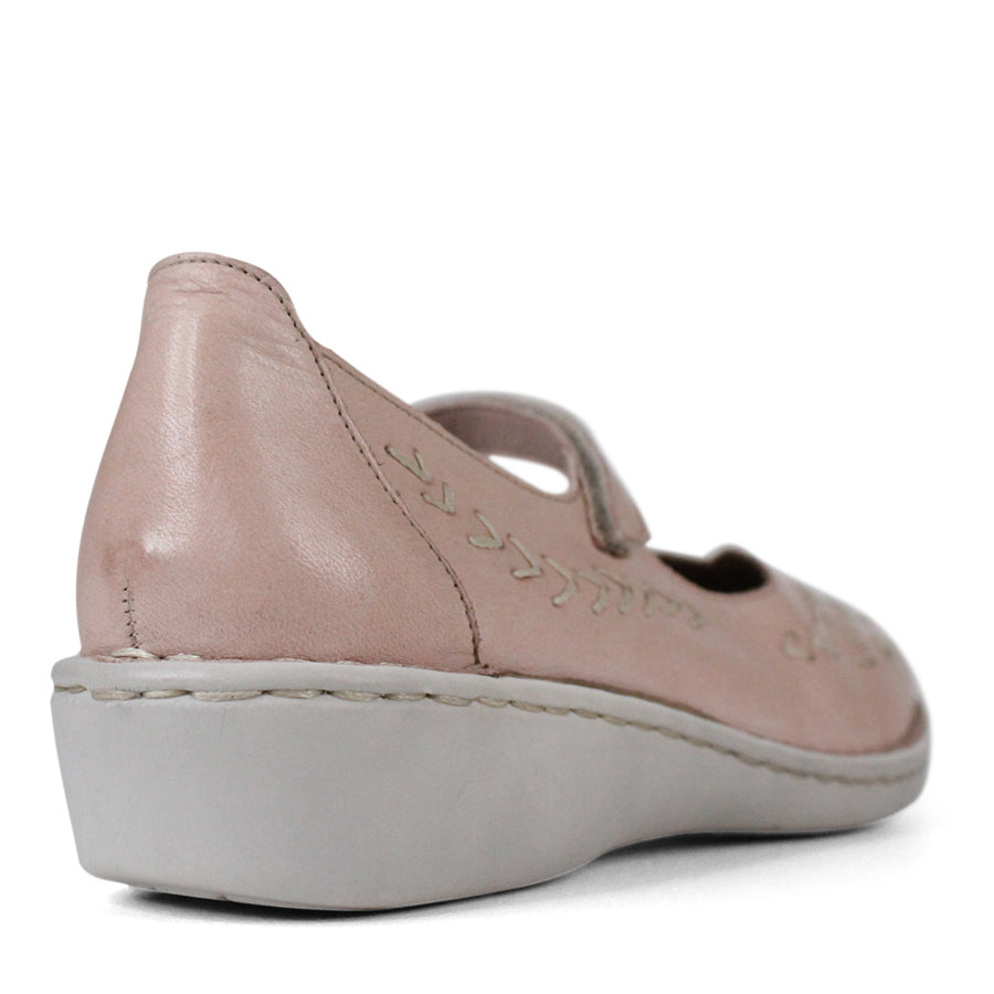BACK VIEW OF PINK LEATHER CASUAL SHOE WITH VELCRO STRAP AND WHITE STITCHING DETAIL