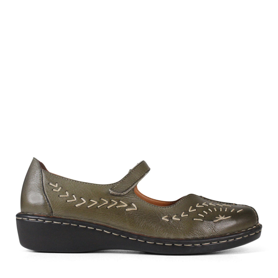 SIDE VIEW OF GREEN LEATHER CASUAL SHOE WITH VELCRO STRAP AND WHITE STITCHING DETAIL