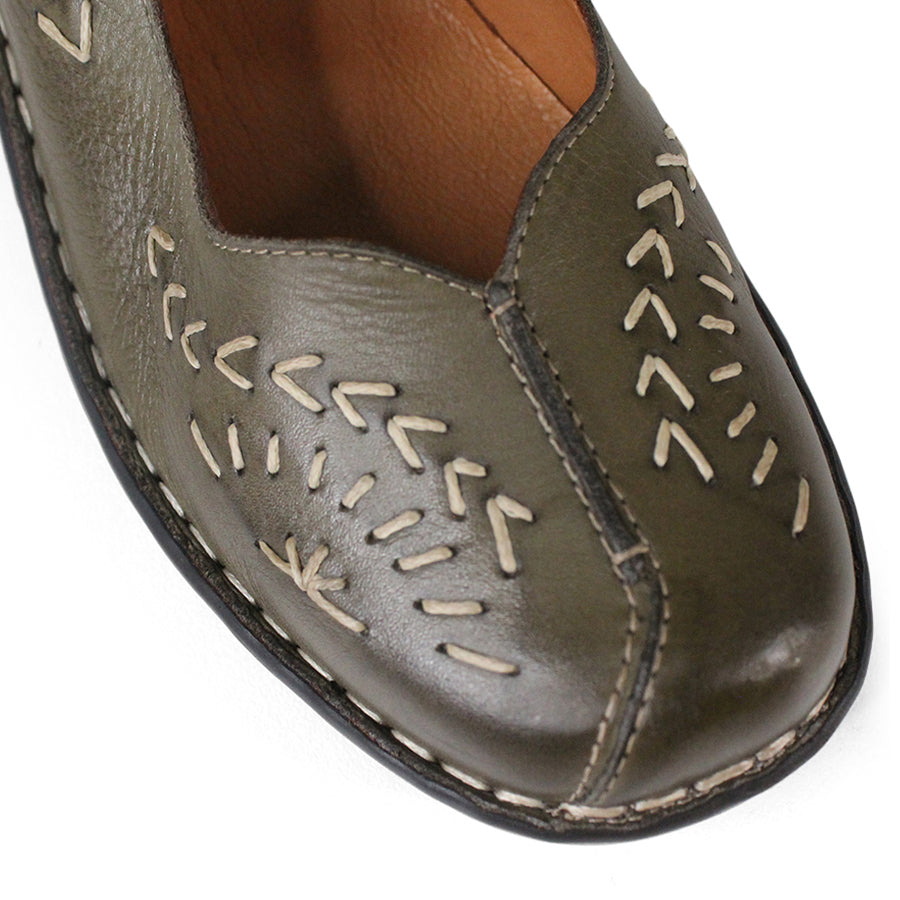 FRONT VIEW OF GREEN LEATHER CASUAL SHOE WITH VELCRO STRAP AND WHITE STITCHING DETAIL