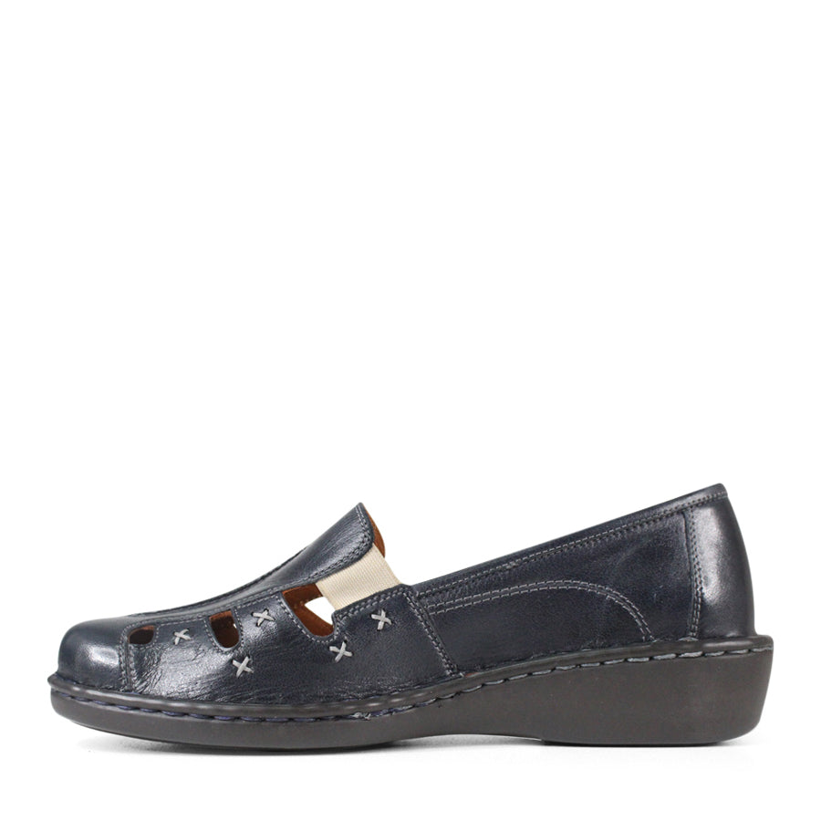 SIDE VIEW OF NAVY LEATHER SANDAL WITH WHITE CROSS STITCHING DETAIL