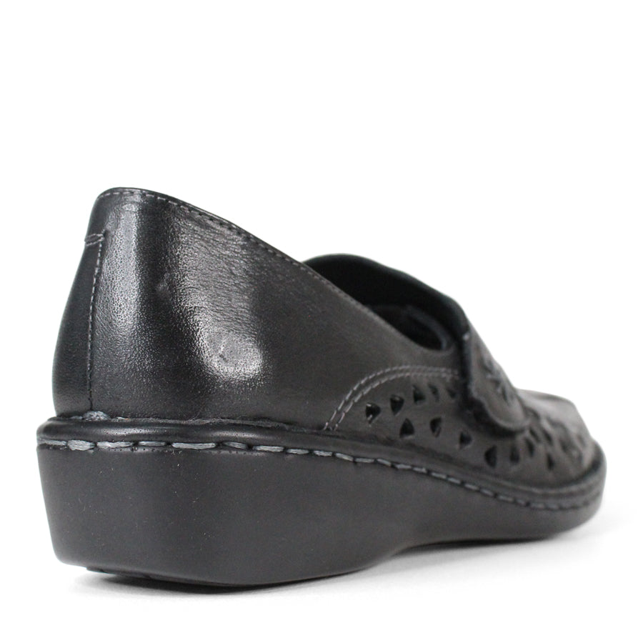 BACK VIEW OF BLACK LEATHER CASUAL SHOE WITH VELCRO STRAP AND TRIANGLE SHAPED CUTOUTS ON THE SIDE