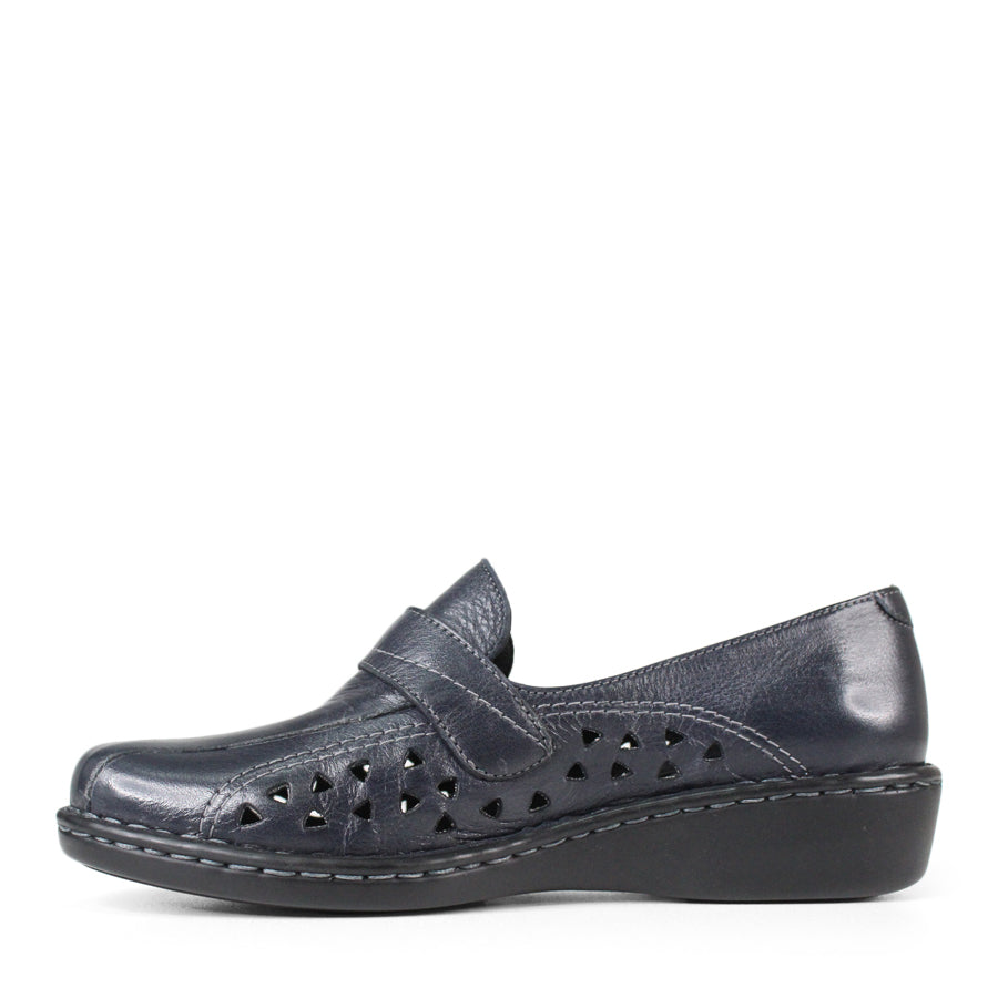 SIDE VIEW OF NAVY LEATHER CASUAL SHOE WITH VELCRO STRAP AND TRIANGLE SHAPED CUTOUTS ON THE SIDE