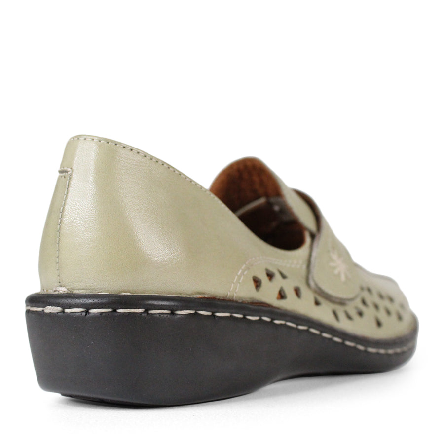BACK VIEW OF LIGHT GREEN LEATHER CASUAL SHOE WITH VELCRO STRAP AND TRIANGLE SHAPED CUTOUTS ON THE SIDE