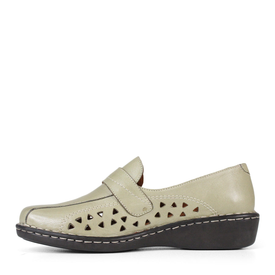 SIDE VIEW OF LIGHT GREEN LEATHER CASUAL SHOE WITH VELCRO STRAP AND TRIANGLE SHAPED CUTOUTS ON THE SIDE