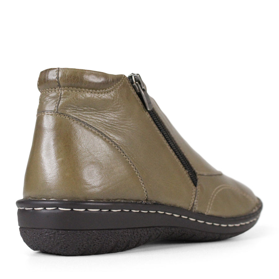 BACK VIEW OF GREEN LEATHER ANKLE BOOT WITH SIDE ZIPPER, BLACK SOLE WITH WHITE STITCHING 