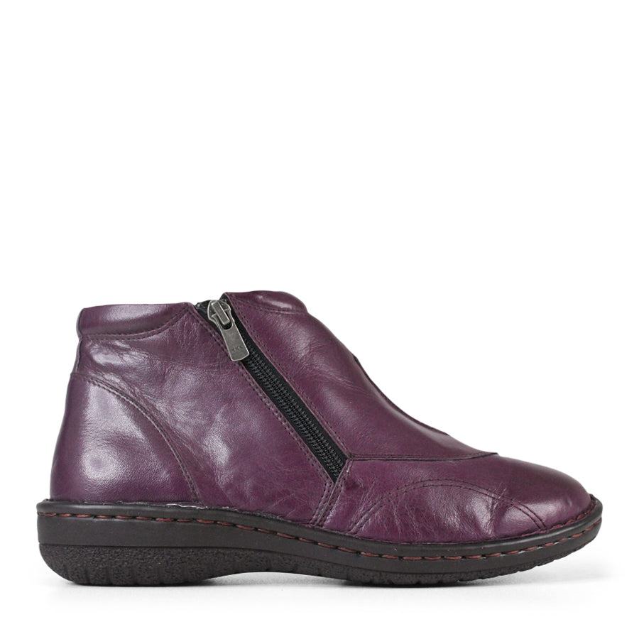 SIDE VIEW OF PURPLE LEATHER ANKLE BOOT WITH BLACK SIDE ZIPPER AND BLACK SOLE