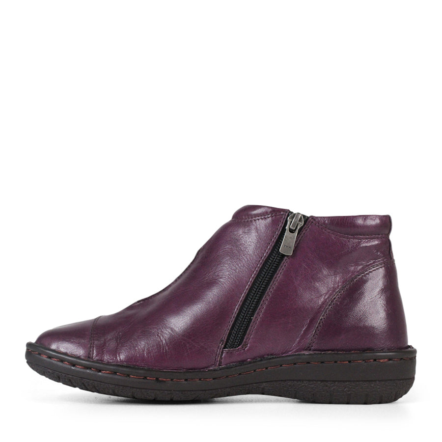 SIDE VIEW OF PURPLE LEATHER ANKLE BOOT WITH BLACK SIDE ZIPPER AND BLACK SOLE