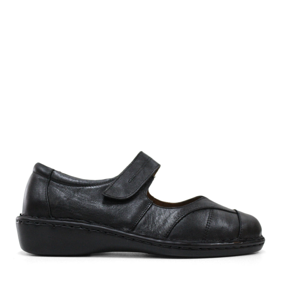 SIDE VIEW OF BLACK LEATHER FLAT CASUAL SHOW WITH VELCRO CLOSURE